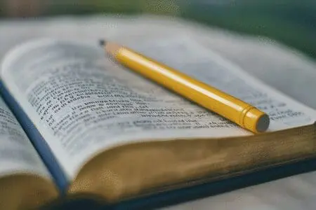 An open Bible with lines and notes in the margin, illustrating a technique for in-depth scripture study