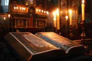 An ornate Eastern Orthodox Study Bible in a church setting with icons and candlelight, representing their official version