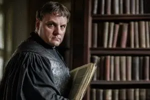 Martin Luther near a printing press with some Bible books separated, revealing his role in the canon