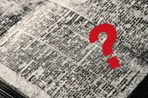 A Bible verse cluttered with extra text and a question mark illustrating the key issues and asking what is wrong with the Amplified Bible