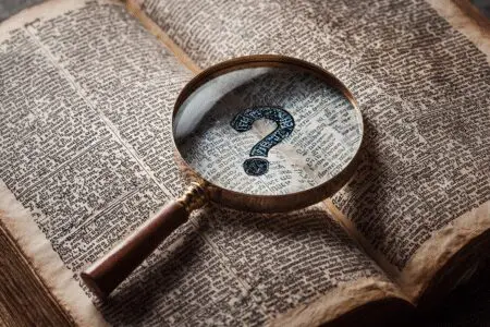 A magnifying glass finding a blank space in the text illustrating the question is the word Rapture in the Bible