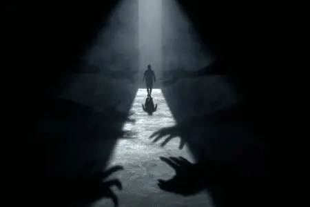 A person overcoming shadowy hands to stay on a path of light illustrating what is temptation in the Bible