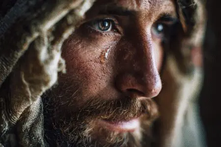 A portrait illustrating how many times did Jesus cry in the Bible showing Jesus weeping with compassion