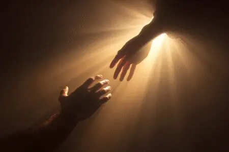 An image of Scripture hope showing what the Bible teaches about suicide with a hand being rescued from darkness