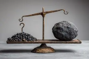 An unbalanced scale with a question mark representing the question does the Bible say all sins are equal
