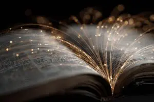 Glowing lines connecting verses within a Bible demonstrating the best cross-reference Bible