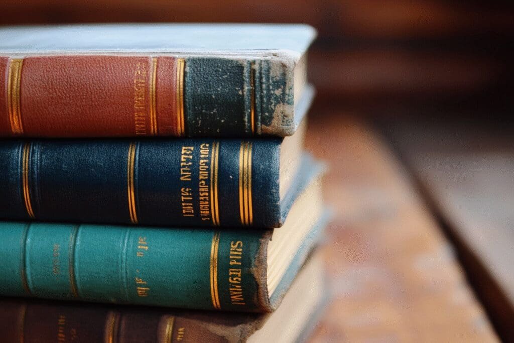 A stack of different Bible versions with one highlighted, representing an answer about their similarities and differences